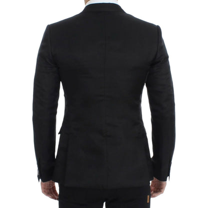 Back view of a Dolce & Gabbana black silk slim fit blazer showcasing its tailored design and elegant finish.