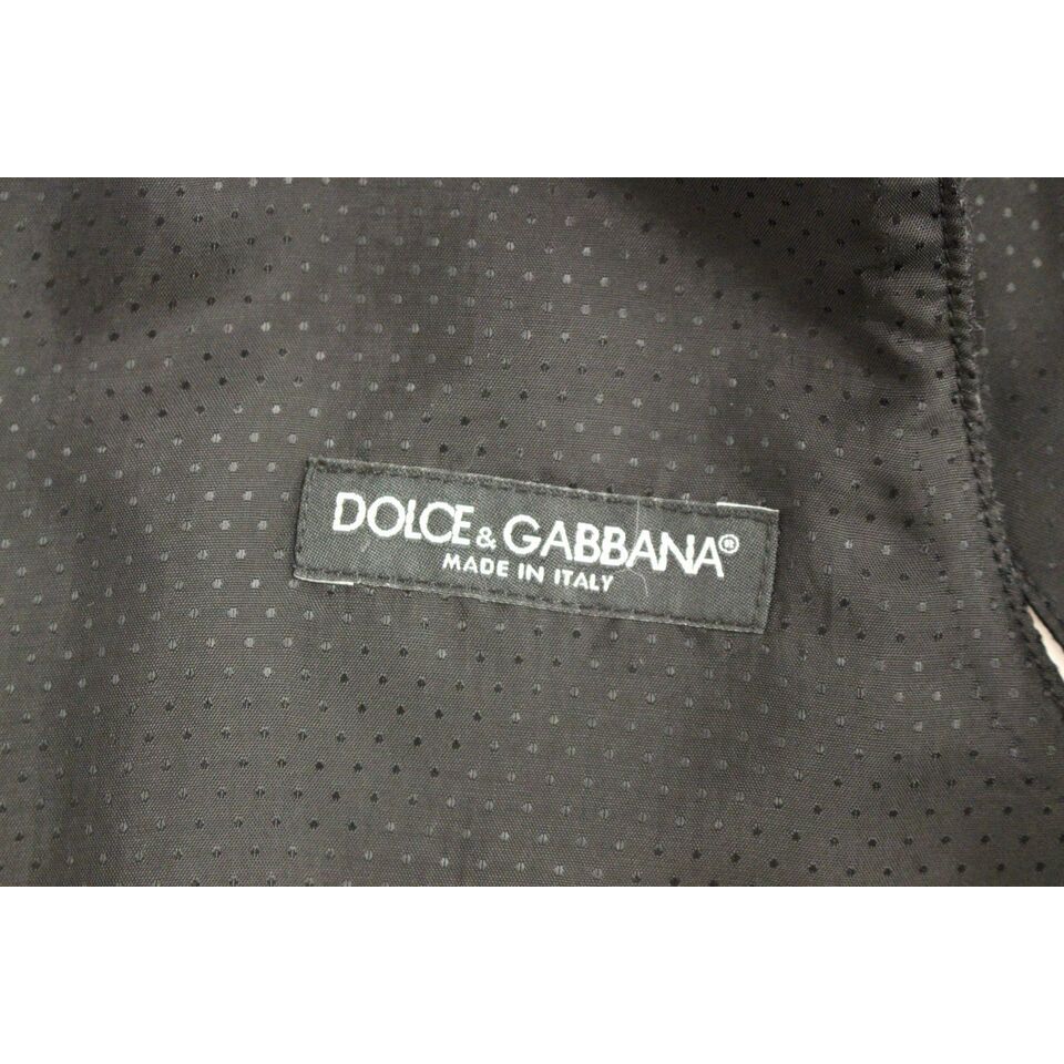 Dolce Gabbana gray wool vest label made in Italy on a fabric background