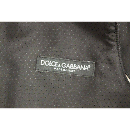 Dolce Gabbana gray wool vest label made in Italy on a fabric background