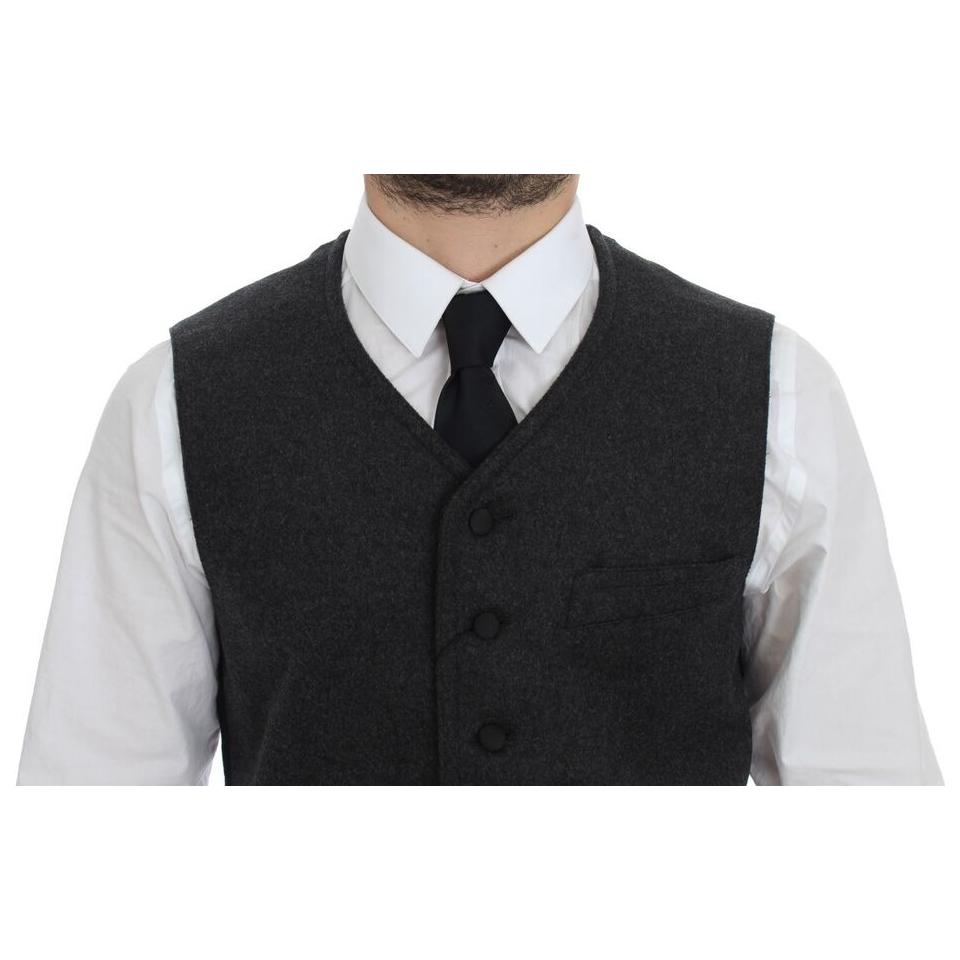 Dolce Gabbana gray wool blend vest worn with a white shirt and black tie, showcasing a stylish front view.