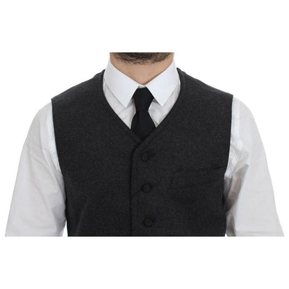 Dolce Gabbana gray wool blend vest worn with a white shirt and black tie, showcasing a stylish front view.