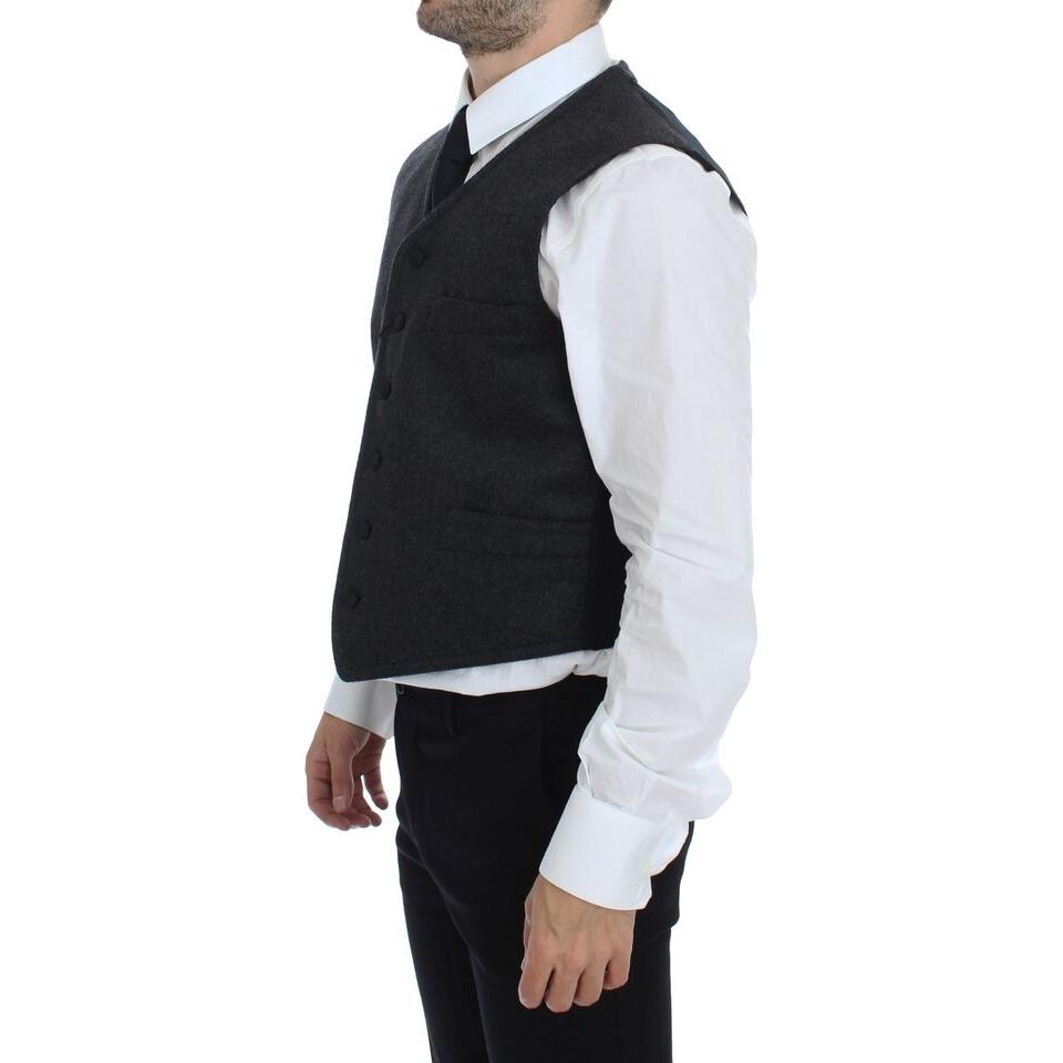 Dolce Gabbana gray wool blend vest showcased in side view, styled with a white shirt and black tie.