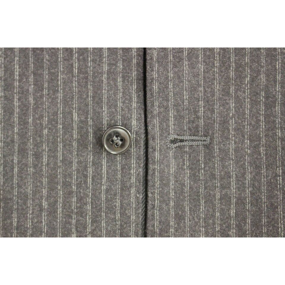 Close-up of Dolce & Gabbana gray striped wool dress vest featuring front button and fine vertical stripes.